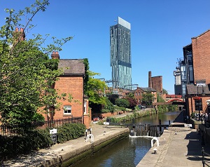 View looking along the Rochdale Canal in Manchester towards the Hilton Hotel