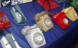 collection of retro telephones with rotary dials