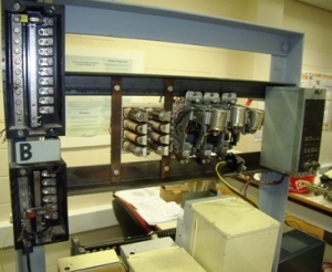 Picture showing the uniselectors and K and LR relays attached to their shelf alongside the fuse panel.