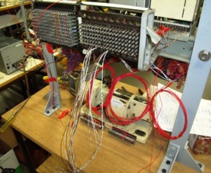 picture showing the rear of the unit where the p wire and voice circuits are being wired via a patch panel