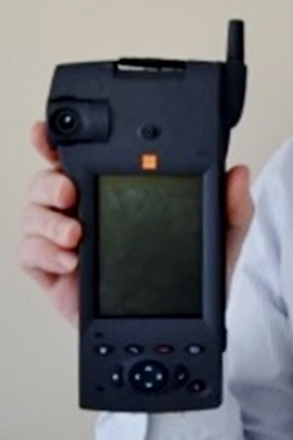 An Orange HSCSD videophone being held in a hand