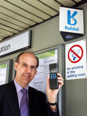 A picture of Nigel Linge reuniting a Rabbit handset with its sign on Watford Junction Railway Station in April 2011